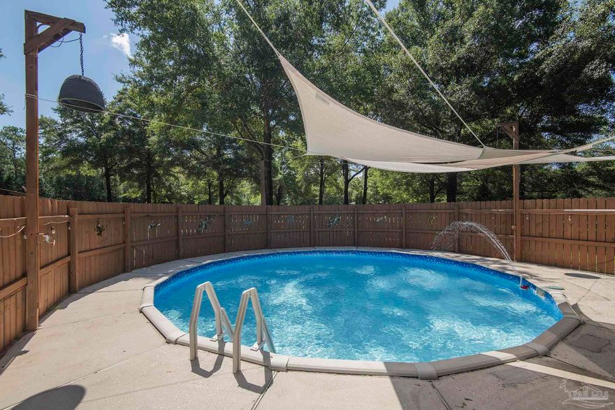 COUNTRY LIVING - this beautiful POOL property boasts 5 ACRES, a massive 2904sqft home, a 1-bed/1-bath 450sqft in-law suite / ADU, a  1050sqft barn, and 2 workshops totalling 1160sqft - both with water/electric! Stepping inside the main house, you are immediately greeted by the open concept living/dining area. The kitchen is a chef's dream, featuring an abundance of storage, updated appliances, and seemingly unlimited counterspace. The master bedroom has more than enough room for a king bed and features a large en-suite bathroom complete with dual vanities, both a soaking tub and walk-in shower, and his-and-hers walk-in closets. The two guest bedrooms both can accommodate queen beds and share an updated bathroom in the hallway. This home features not just 1, but 2 bonus rooms. One of these bonus rooms is suitable as a home office or 4th bedroom. The third is a 450sqft secondary living room or man cave complete with a small office and views of the pool. The fenced back yard provides a secure space for pets and plenty of room for entertaining guests. The garage is massive, with 6 doors allowing access from all sides and built in storage. The pool area outside is perfect for barbecues and lounging in the sun. Located directly next to the main home is a small, detached workshop with electric and power, perfect for any projects you may have. One of the major bonuses of this property is the huge barn with water and electric, perfect for horses or other livestock. Another bonus is the 1 bed/1 bath 450sqft in-law / ADU tucked away in its own private corner of the property. With its own 2-car carport, living room, kitchen, and a full bedroom and bathroom, this would be perfect for family/friends or as a short-term rental! Like the main home, the in-law suite also has a detached workshop with water and electric. Stop on by and see all this property has to offer before someone else does!