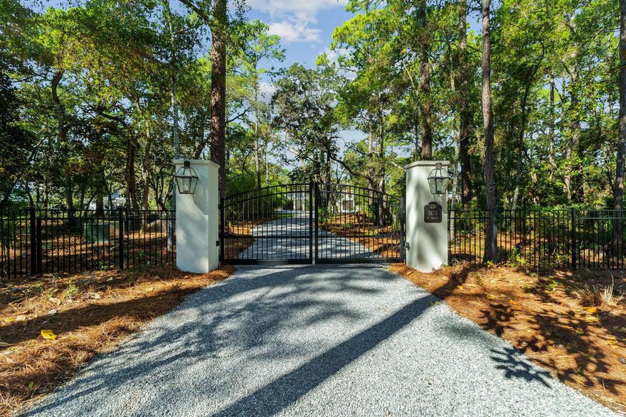 (Combined listing for 1455 & 1475 Hewett Rd)  Tucked away behind private gates, this extraordinary waterfront estate redefines luxury coastal living on Hewett Bayou with 1.66 acres of prime bayfront land, 170 feet of year-round deep water frontage, and two impeccably designed docks--crafted for those who live life on the water. A winding drive meanders beneath a lush canopy of live oaks and towering pines, setting the stage for an estate that is both exquisite and private.Built in 2019 by the esteemed Burrell Elliott, this masterfully constructed residence is a testament to superior craftsmanship, offering an elevated fusion of architectural refinement and modern functionality. Every detail has been meticulously curated, from the finest high-end finishes to state-of-the-art appliances, ensuring both comfort and effortless sophistication.

For the dedicated boating enthusiast, this estate is unmatched in its offerings. The two 85' x 407' adjacent lots provide unparalleled privacy and space, while the fully equipped docks - each boasting a 12,000-lb. covered boat lift, fresh water, power, and flow-through platforms - allow for seamless docking, world-class fishing, and endless days on the open water. A full composite-decking dock ensures both durability and timeless appeal.

As the sun melts into the horizon, the waterfront transforms into a serene masterpiece, casting breathtaking golden reflections across the bayou-best enjoyed from the private pool or the elevated outdoor living space, where a 75-inch TV, sound bar, and built-in gas grill create a flawless setting for luxurious al fresco entertaining.

Inside, the chef's kitchen is nothing short of spectacular, featuring a Wolf six-burner range with griddle, Sub-Zero refrigeration, an additional full-size freezer, and a Boos custom butcher block island. A gas fireplace adds warmth to the living area, complemented by tailored window treatments and remote-controlled Hunter Douglas shades, enhancing both privacy and ambiance.

The lower level, a solid concrete block structure with oversized pilings, offers 1,120 square feet of unfinished space, wired for AC and electrical - an exceptional opportunity for expanding living quarters, a guest retreat, or a bespoke workshop. This level also features a bathroom, cast iron Kohler double sink, built-in storage, and workbenches, while composite stairs lead to the upper terrace, seamlessly blending indoor and outdoor living.

Every inch of this estate is engineered for unparalleled convenience and security, with a whole-home generator powered by a 300-gallon owned propane tank, two tankless water heaters, a full water filtration system, two deep-water wells, and Reme Halo UV light air purifiers in both AC handlers. The meticulous attention to detail extends to stainless steel hardware throughout, and every window and door is expertly cased for durability.

As an added advantage, the second vacant lot includes architectural plans for an additional luxury residence, offering the potential for expansion or the preservation of unmatched seclusion. With no HOA restrictions, this estate is a rarity - offering a harmonious blend of privacy, grandeur, and deep water access, ideal for those who appreciate expansive land, oversized garages, and a life seamlessly intertwined with the water.

Fine dining, luxury shopping and leading hospital and medical care are just minutes away. This is more than a home - it is a legacy estate, an exclusive retreat, and a once-in-a-lifetime opportunity to own a meticulously designed coastal sanctuary, where boating, fishing, and effortless luxury converge in perfect harmony.