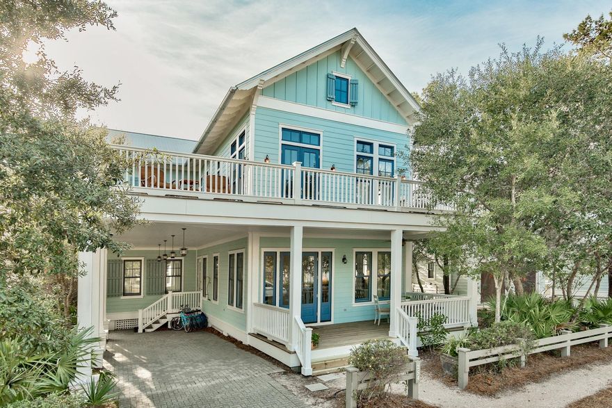 Custom home with rental revenue over $140,000/yr! This luxury home is being sold furnished, with 5 bikes, and all the outdoor furniture needed for over 2,000 sq. ft in porches! Combined with 3 fireplaces, there is ample space for both indoor and outdoor gatherings. The lot is adjacent to a 10' buffered bike path adding extra space between homes. Spacious, open living with ample room for family and friends. New paint and outdoor decks freshly stained. The master bedroom features a beamed coffered ceiling, cottage wainscoting, custom maple closets as well as a bath that features an Ultra Bain Air Jacuzzi tub, and double shower heads in the spa-like shower with split-face European stone.