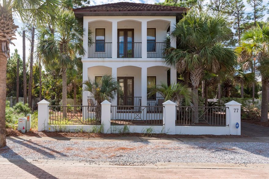 In the Village of White Cliffs, a gated, rental-restricted community south of 30A in charming Blue Mountain Beach, you'll find this spacious three-bedroom home just a block and a half from the private neighborhood beach access. On the ground floor, high ceilings and ample windows create a bright kitchen and living area complete with Bose surround system, a large breakfast bar, and French doors that open onto a covered outdoor seating area and private brick patio. The ground floor also offers the convenience of a large guest suite complete with private bath and walk-in closet.