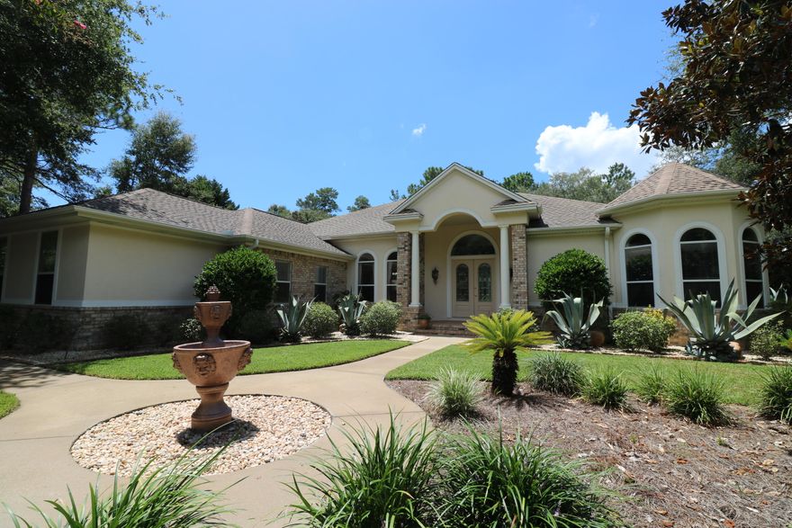 BORN TO BE BEAUTIFUL! This built-to-last pool home is so vain! She's move-in ready. Start with the grand entry, high ceilings, and bamboo flooring. From there, the family room features large windows, electric fireplace, and a wet bar with wine fridge.Kitchen boasts pull out cabinet drawers, convection microwave, Corian countertops, island with gas cooktop, an eat-in bar, and breakfast area. The luxury master suite shows off two walk-in closets, sliding doors to pool area, cove lighting in tray ceiling, office area, and a master bathroom with cultured marble, double vanity, and whirlpool tub.The backyard is envied for its lanai and fire pit areas.Enjoy your heated pool and hot tub with LED splash lighting.At closing, with a full price offer, seller will credit buyer $8000 for new appliances Backyard oasis will supply tons of happiness to its new owners. Pool has a new Hayward automatic pool cleaner.Other amenities include laundry room, 3 car garage, and speaker system throughout inside and out. Other features: Alarm system, 40 year warranty on roof, motion alarm in pool, and fireplace. The desirable Swift Creek subdivision features- Underground utilities, street lights, sidewalks, community room, pool, and tennis. Location is close to shopping, world class dining, medical facilities, golf, tennis, and of course, the sugar white beaches of the Emerald Coast!