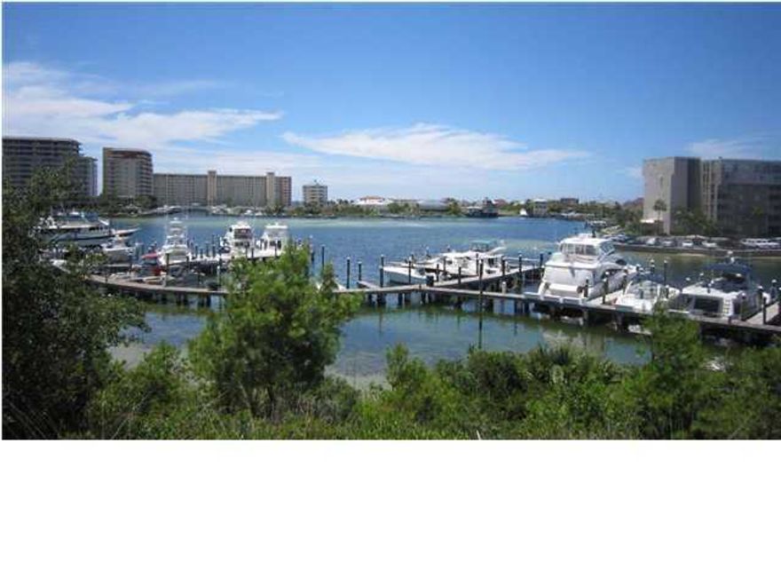 Property sits on top of a 22 foot bluff over looking the Destin Harbor, with a magnificent view to the west. Property has a design code so as to keep the integrity of the homes and property. Must see to believe it. ALL UTILITIES IN PLACE