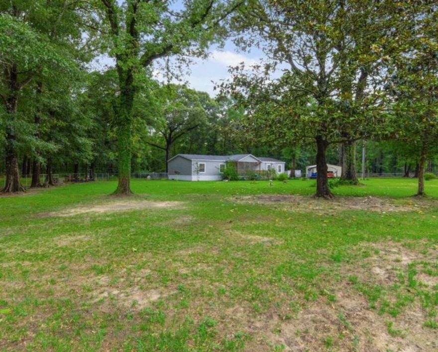 Enjoy Country Living In This Lovely 4 Bedroom 2 Bath Mobile Home Sitting On Over An Acre Of Fenced Land! This Spacious Home Features A Large Kichen With Lots Of Cabintry, Huge Island And An Awesome Pantry! The Home Has A Large Master Bedroom, Bathroom And Laudry Room. Enjoy Your Morning Coffee Or Evening Glass Of Wine On Either The Covered Front Or Back Porch!