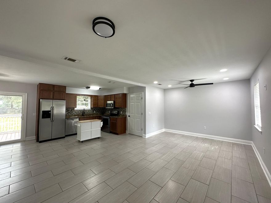 Super cute and located in the heart of Crestview. This all-brick home rests on 1/2 acre and has fenced back yard. Home has open deck on the back of the property, sliding vinyl door leading from dining area to the deck as well as an exit door at the oversized laundry/pantry. There's an open floorplan with carpet in the bedrooms and tile in the rest of the house.