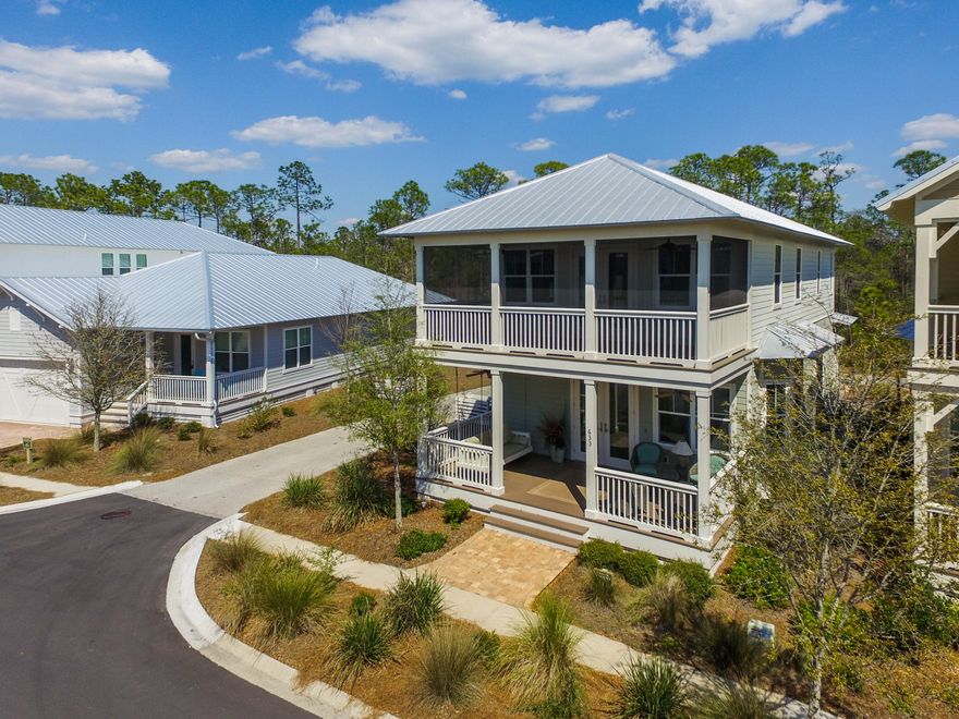 LOCATION, LOCATION, LOCATION. The only Sea Breeze home backing to preserve left in Phase 2. Close the Gathering Place and playground, w/ quick access to the community beach trail. This gorgeous home has 3 porches (2 screened) to enjoy all the beauty that surrounds you. Pavers were also added off the back porch area for grilling or maybe a future fire pit! This home is sold furnished and full of upgrades not found in new construction- fireplace, screened porches, built in bunk beds, designer lighting, window treatments throughout, etc. Rental income is great on the home with projected income of $52k. All this, FURNISHINGS and CDD bond already paid off make this home a steal of a deal! This floor plan offers a very open living, kitchen, dining area with guest suite on the 1st floor. GE Gas range, upgraded cabinets, backsplash, generously sized island, and under cabinet lighting are just some of the features in this kitchen. Wood floors throughout, crown moulding, vgroove are some other features.   Great heated and cooled storage closet outside for bikes, beach chairs, Yolo boards. Would also make a great owner's lockout if renting the home out. Upstairs you will find a great loft area with screened porch right off of it. Upgrades master bath layout with stand up shower and soaking tub in addition to huge room and walk in closet!  Another guest room and bunk room (small 4th bedroom) make this a perfect home for you and your family and all your friends! NatureWalk has become the premier spot for vacationers and full time residents wanting to be close to all the fun on 30A and Seaside but to be a little off the beaten path. We are just a short bike ride away from Seaside, Watercolor and the Beach. Community shuttle runs Memorial through Labor Day and will pick you up at your home and drop you off at the beach or Seaside. The Gathering Place includes a zero entry pool, lap pool (heated in the winter), kiddie pool, bar area for parties, fire pit, grills, tv, etc. Other community amenities include fitness stations throughout, gorgeous trails through the forest, sports court, fishing pond, and green spaces!
