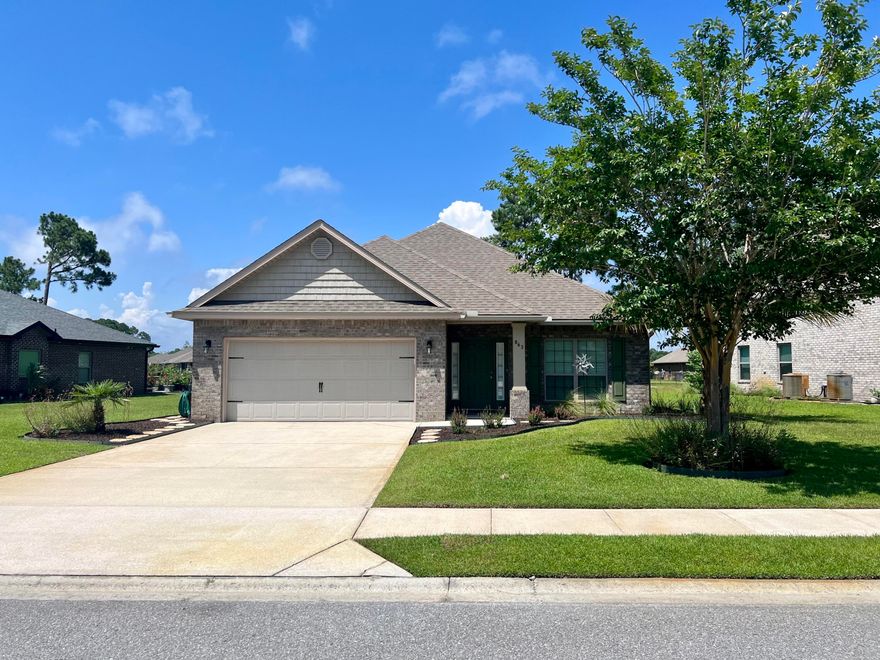 Perfectly maintained home in the sought after Driftwood Estates neighborhood in Santa Rosa Beach. This all brick, 3 bedroom, 2 bath split floor plan beauty is situated on a large lot with a pond at the back of the lot. Upon entering the home you'll be greeted by a welcoming foyer leading to an office/den at your immediate right. Continue on to find a gorgeous kitchen featuring stainless appliances, granite countertops, lots of cabinet space, upgraded tile backsplash, and a center island with storage. Also in the kitchen is a dining area and pantry. Just beyond the kitchen is a large living room with trey ceiling and access to the covered patio and backyard. The master bedroom is very spacious and boasts a trey ceiling, wood flooring and a master bath with garden tub