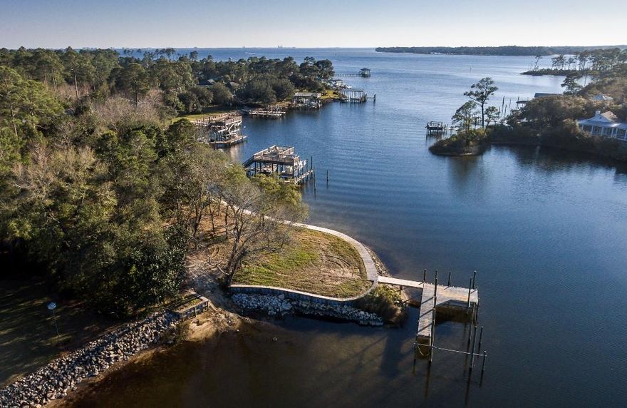 RARE WATERFRONT LOT ON SHIRKS BAYOU IN DANA POINTE!! One of a kind lot on deep, protected water with gorgeous bayou and bay views. This lot is located at the end of a very private cul-de-sac and is studded with amazing hardwood trees that will grace your future dream home. A unique feature of this lot is the waterfront ''point'' that has over 160' of shoreline and is 105' wide. There is already a seawall and a dock (both offered ''as is'') in place as well as a launch area for kayak's or paddle boards! This lot can truly make all your waterfront dreams come true!