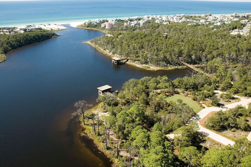 Nature and beach lovers alike will find all that they need in the Draper Lake Community. Based on the orientation of this lot the front and back of any prospective home will have green space views. This lot is on the west end of the development allowing convenient passage to the beach access. Lot is set directly across from the 40-foot observation tower capturing panoramic views that include the emerald waters of the Gulf of Mexico and comes with approved plans that are valued at $25,000. This home site will have a Type II house as indicated in the Draper Lake design code. One of the last lots left in a great location.