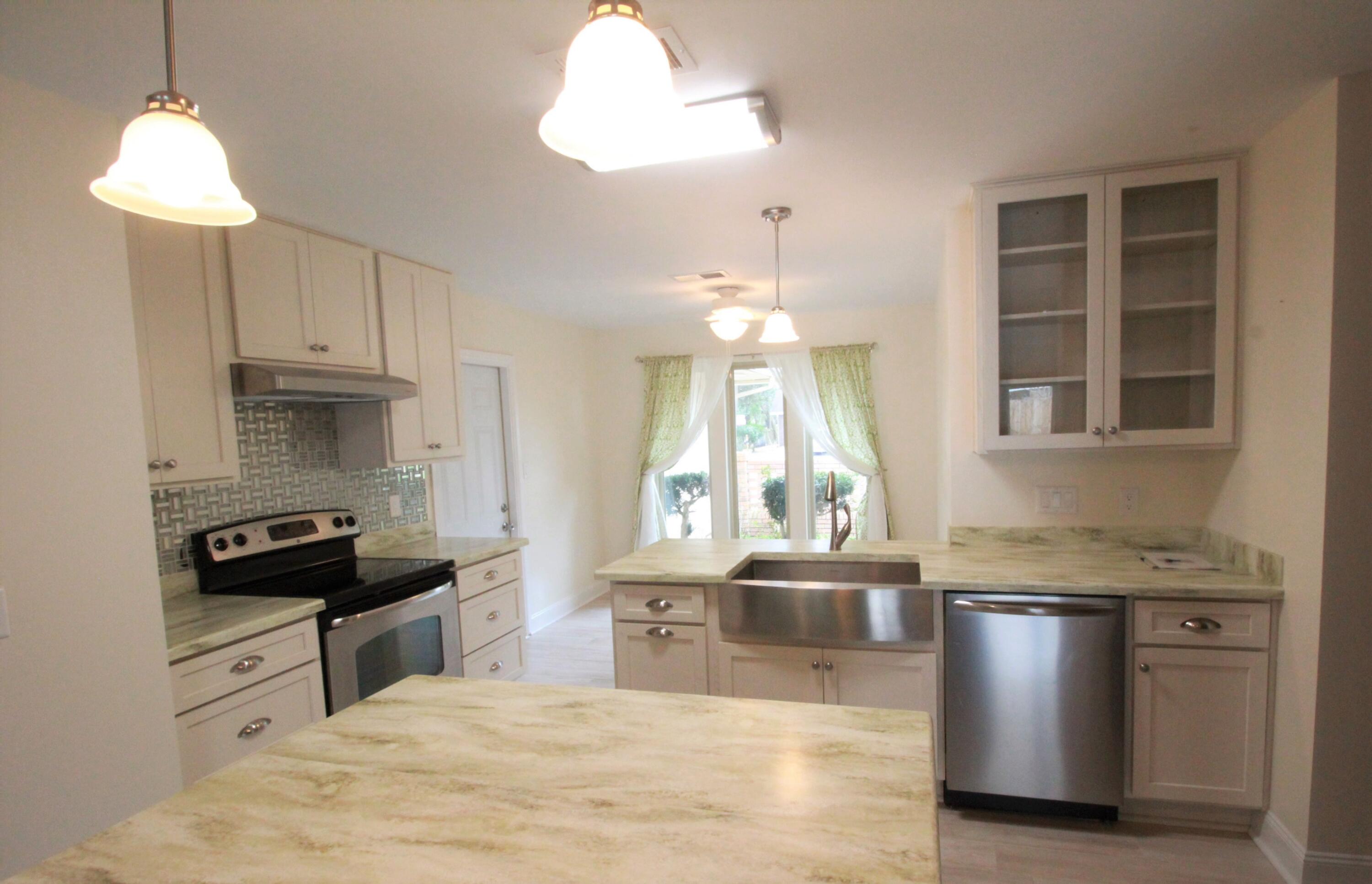 Put your personal touch on this wonderful 4 bedroom, 2.5 bath home in the highly desired Kenwood neighborhood of Fort Walton Beach! Featuring an in-ground swimming pool, spacious yard with new privacy fence, and open concept living, this home is made for entertaining! The kitchen was updated in 2020 with quartz counters, new cabinets featuring soft close doors and drawers, stainless steel appliances, beautiful light wood looking floors, and a large apron sink. Enjoy eating in the bright breakfast nook, or entertaining in the large formal dining area! If you don't need a dining room, it would make a wonderful office or kids play room! In addition, this home features two large living areas; one at the front of the home and the other just off the kitchen overlooking your sparkling pool and