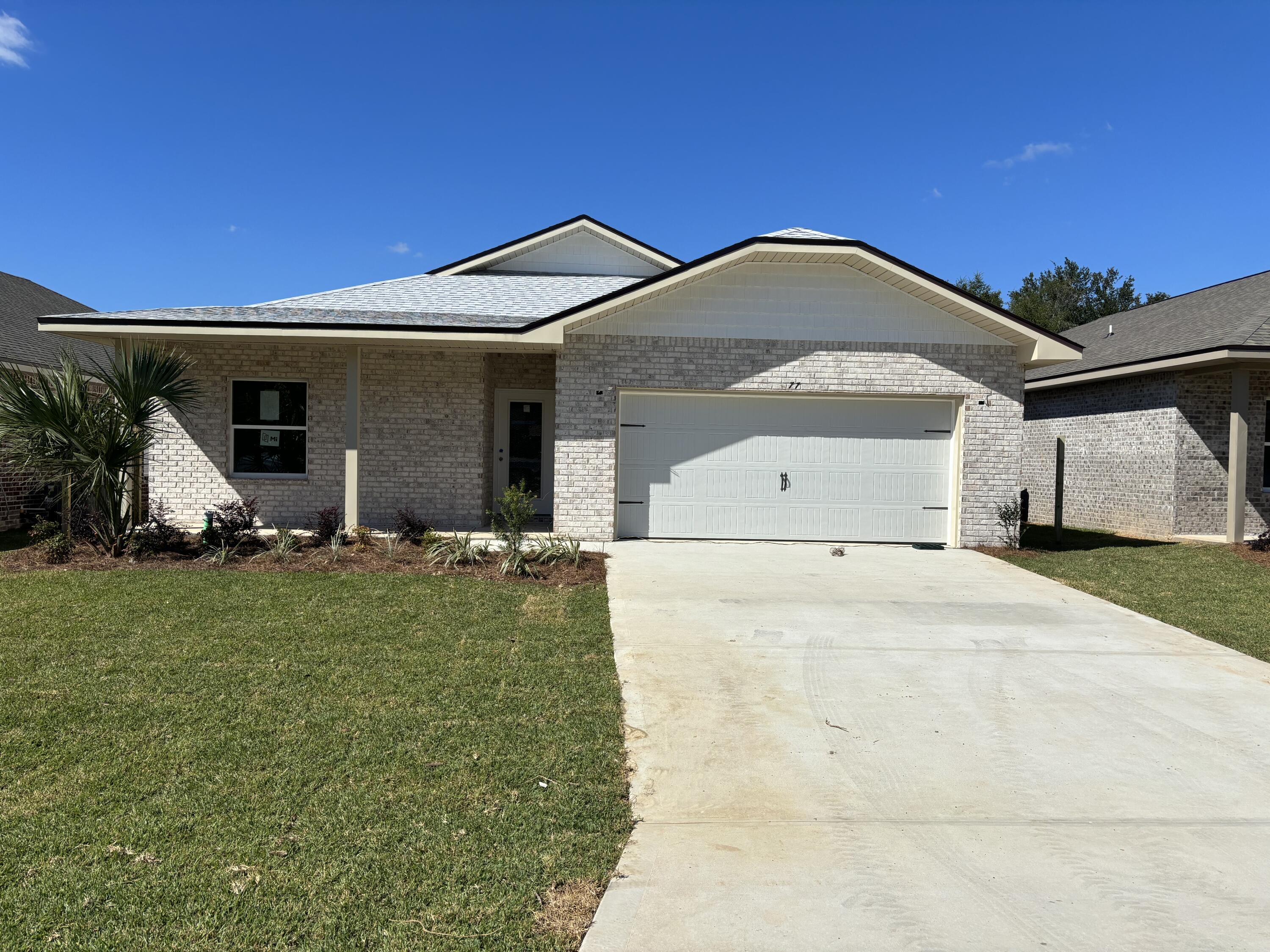 Seller paying up to $15000 in buyers closing costs. New construction in the heart of Shalimar. This 3BR/3BA, 2CG custom brick homesite has 9 Ft. ceilings w/ impressive crown molding, LVP flooring throughout most of the home, tile in the master bath, and 5 1/4'' baseboard throughout. Kitchen boasts custom painted white cabinetry, granite countertops, a large pantry, and stainless appliances. Master suite is in the left rear of the home, is very roomy, has 2 large walk - in closets, a marble walk - in shower with glass enclosure, a whirlpool garden tub and double vanity. The yard is beautifully landscaped, has a privacy fence, and comes complete w/ a sprinkler system, well and timer. Insurance will be very reasonable, as home is built to today's code. Fabric hurricane protection is included for the owner's piece of mind.