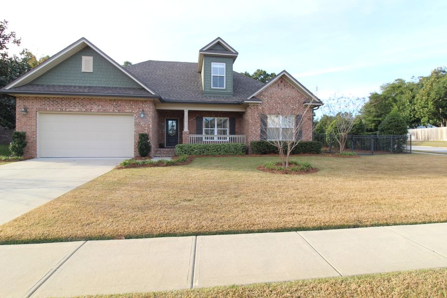 Immaculate home in Hawk's Landing, adjacent to Turkey Creek Park. Bring your swim suits and paddle boards. As you walk up to the welcoming front covered porch you are will admire the warm welcoming front entry into the Foyer, you'll already feel the loving care this home has. To your right through the stained wood French doors opens to the spacious office. Straight ahead you enter a cozy great room with raised ceilings boasting a floor to ceiling gas stone fireplace. The Kitchen is to your left featuring a custom built in china cabinet, granite counter-tops, farmhouse sink, double oven with 6 stove top gas burners and built in microwave above. Enjoy time with the family as they gather around the high-top breakfast bar which over looks the great