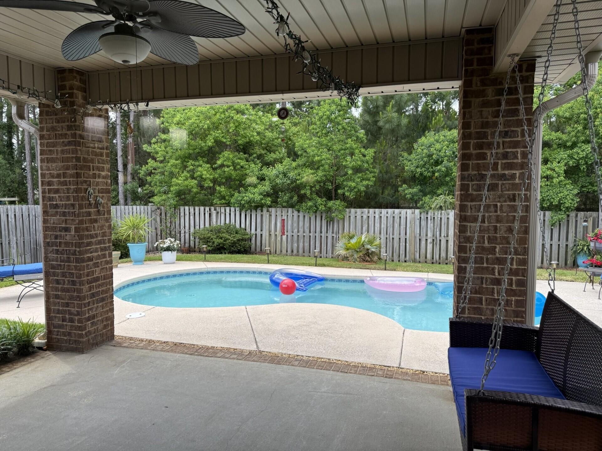 We are so excited to present this GREAT opportunity for you to purchase your own piece of PARADISE! Nestled in the cul-de-sac adjacent to the neighborhood pond with a lovely fountain. This Wonderful family home in Driftwood Estates is offering the LIFESTYLE you have been searching for! One of only a few homes in this highly sought after community that has a PRIVATE POOL. This beautiful all BRICK home with it's welcoming TROPICAL landscape has 3 BEDROOMS plus a FLEX room which can be used as a 4th bedroom, office, exercise or playroom and is located just minutes away from the sugar white sands of the Beaches of South Walton, and Scenic HWY 30-A. The OPEN CONCEPT floor plan delivers an inviting and spacious gathering area, encompassing the living room, dining area and kitchen. The gorgeous updated kitchen, with a built in PANTRY is well lit with under cabinet lighting and can lights above the cooktop, adorned with White painted cabinets and topped with GRANITE countertops complete with SUBWAY glass tile backsplash. While preparing nourishment on the gorgeous GRANITE counter tops and STAINLESS steel appliances you can still participate in the activities and enjoyment!. The TRAY ceilings in the main living area and in the primary bedroom provide a Grand, spacious feeling and are cased with Crown Molding. The floors in the main living area & primary bedroom are clad with upgraded HARDWOOD planks, while 20" TILE floors cover the foyer, kitchen & bathrooms, and carpet is in the additional bedrooms. The living room, primary bedroom, primary bathroom, flex room, guest bedrooms & dining room all have Custom PLANTATION shutters covering the windows. The primary bath has DUAL sinks, a soaking TUB and a SEPARATE walk-in TILE shower. Add that extra special touch to your gathering, just meander out back to your COVERED patio where you can relax and enjoy the backyard OASIS encased with a SHADOW BOX fence and a natural PRIVACY tree line barrier. Take a relaxing dip to lounge or swim in your PRIVATE pool. To better complete the outdoor living space, there is a fantastic paverstone GRILLING area adjoining the covered patio. This home delivers a wonderful outdoor space for the family to truly enjoy the Florida LIFESTYLE and is maintained by a personal IRRIGATION well pump and sprinkler system. A NEW HVAC system was installed in March, 2024, and a new POOL PUMP system was installed in 2023. For that extra feeling of security, there are hurricane FABRICS to cover every window. There is extra parking for your friends and family with the 2 CAR garage and long concrete driveway. The garage has pull down attic stairs leading to additional potential storage above. The laundry room has full hook ups ready for your Washer & Dryer. For the outdoorsmen or sportsmen in the family there are several beautiful, stocked and well-maintained community lakes. Allowing great opportunities for catch and release fishing. If you choose to use it.....Driftwood Estates PH II provides and maintains for it's owners and their guests a gorgeous community pool to splash and play in the Florida sun! This home is located in Flood Zone X, flood insurance is NOT REQUIRED. Approximately 1/2 mile to Walton County's Driftwood Park, complete with a host of sports related activities; tennis, handball, basketball, soccer, track and a wonderful play ground for the children. When venturing out of the community, you are surrounded by a true resort town with WORLD CLASS restaurants, a wide array of SHOPPING and various entertainment venues. Deep sea fishing, snorkeling, scuba diving, parasailing, golf, boating, go-carts, helicopter rides, bike paths and nature preserves, what more could you be looking for? All of this and it is 3 miles to SACRED HEART HOSPITAL and medical facilities. This property has so much to offer and awaits the person that is ready to bring their special touch and make it HOME! Schedule your private viewing today and start making your Florida LIFESTYLE dreams come true!