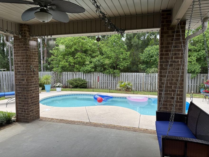 We are so excited to present this GREAT opportunity for you to purchase your own piece of PARADISE! Nestled in the cul-de-sac adjacent to the neighborhood pond with a lovely fountain. This Wonderful family home in Driftwood Estates is offering the LIFESTYLE you have been searching for! One of only a few homes in this highly sought after community that has a PRIVATE POOL. This beautiful all BRICK home with it's welcoming TROPICAL landscape has 3 BEDROOMS plus a FLEX room which can be used as a 4th bedroom, office, exercise or playroom and is located just minutes away from the sugar white sands of the Beaches of South Walton, and Scenic HWY 30-A. The OPEN CONCEPT floor plan delivers an inviting and spacious gathering area, encompassing the living room, dining area and kitchen. The gorgeous updated kitchen, with a built in PANTRY is well lit with under cabinet lighting and can lights above the cooktop, adorned with White painted cabinets and topped with GRANITE countertops complete with SUBWAY glass tile backsplash. While preparing nourishment on the gorgeous GRANITE counter tops and STAINLESS steel appliances you can still participate in the activities and enjoyment!. The TRAY ceilings in the main living area and in the primary bedroom provide a Grand, spacious feeling and are cased with Crown Molding. The floors in the main living area & primary bedroom are clad with upgraded HARDWOOD planks, while 20" TILE floors cover the foyer, kitchen & bathrooms, and carpet is in the additional bedrooms. The living room, primary bedroom, primary bathroom, flex room, guest bedrooms & dining room all have Custom PLANTATION shutters covering the windows. The primary bath has DUAL sinks, a soaking TUB and a SEPARATE walk-in TILE shower. Add that extra special touch to your gathering, just meander out back to your COVERED patio where you can relax and enjoy the backyard OASIS encased with a SHADOW BOX fence and a natural PRIVACY tree line barrier. Take a relaxing dip to lounge or swim in your PRIVATE pool. To better complete the outdoor living space, there is a fantastic paverstone GRILLING area adjoining the covered patio. This home delivers a wonderful outdoor space for the family to truly enjoy the Florida LIFESTYLE and is maintained by a personal IRRIGATION well pump and sprinkler system. A NEW HVAC system was installed in March, 2024, and a new POOL PUMP system was installed in 2023. For that extra feeling of security, there are hurricane FABRICS to cover every window. There is extra parking for your friends and family with the 2 CAR garage and long concrete driveway. The garage has pull down attic stairs leading to additional potential storage above. The laundry room has full hook ups ready for your Washer & Dryer. For the outdoorsmen or sportsmen in the family there are several beautiful, stocked and well-maintained community lakes. Allowing great opportunities for catch and release fishing. If you choose to use it.....Driftwood Estates PH II provides and maintains for it's owners and their guests a gorgeous community pool to splash and play in the Florida sun! This home is located in Flood Zone X, flood insurance is NOT REQUIRED. Approximately 1/2 mile to Walton County's Driftwood Park, complete with a host of sports related activities; tennis, handball, basketball, soccer, track and a wonderful play ground for the children. When venturing out of the community, you are surrounded by a true resort town with WORLD CLASS restaurants, a wide array of SHOPPING and various entertainment venues. Deep sea fishing, snorkeling, scuba diving, parasailing, golf, boating, go-carts, helicopter rides, bike paths and nature preserves, what more could you be looking for? All of this and it is 3 miles to SACRED HEART HOSPITAL and medical facilities. This property has so much to offer and awaits the person that is ready to bring their special touch and make it HOME! Schedule your private viewing today and start making your Florida LIFESTYLE dreams come true!