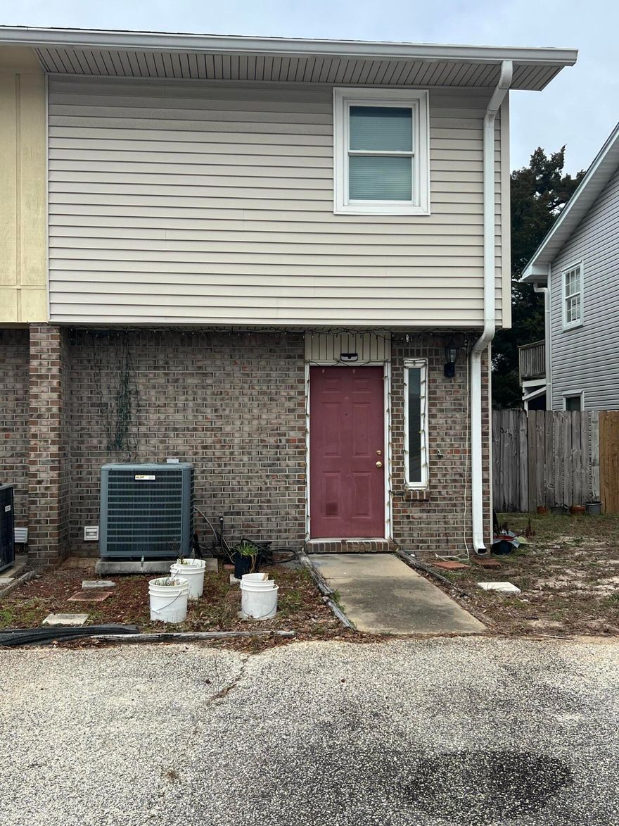 LOCATION! Corner unit with large yard. Open deck and covered patio downstairs and balcony off master bedroom. Open and bright floor plan. Breakfast bar, pantry, and large laundry room with shelving.  Needs some TLC but great buy!! Don't miss out! Plus AirBnb friendly, so good income potential