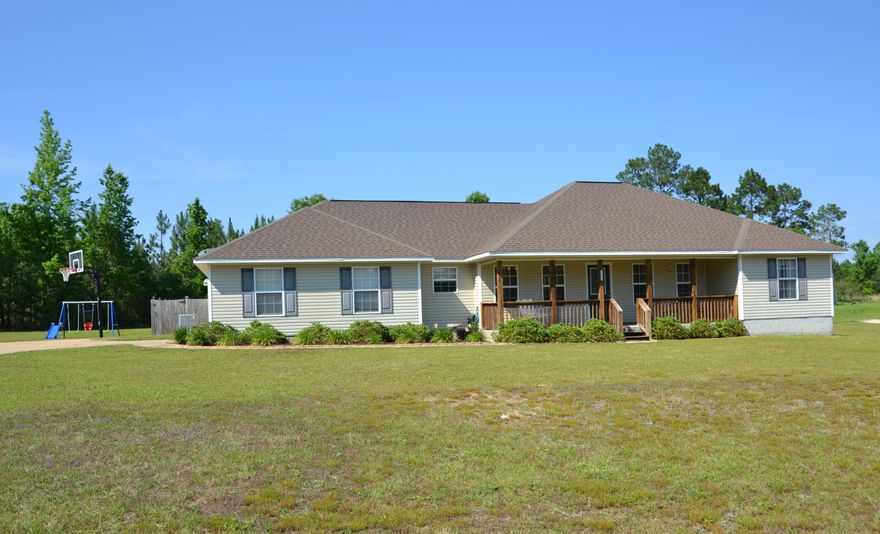 Enjoy Country Living just outside of town! 2 Acres with Future zoning of Agriculture; Bring your chickens! 2 porches and Fenced Back Yard. Seller is offering to pay most of YOUR Closing Costs and a 1 Year Home Warranty! Over 1,700 sq.ft. Split Bedroom Floor Plan with 3 Bedrooms and 2 Bathrooms. Open Kitchen is equipped with Stainless Steel KENMORE Appliances, Breakfast Bar, TONS of Cabinets, and Pantry; plus access to the Back Porch! Be a part of the action in the Kitchen with a view to the Dining Area and Living Room. Living Room has double french doors with access to the Back Porch. Master Suite is located off the Kitchen. Master Bedroom has an 8'5''x6' Walk-in-closet. Master Bathroom has a Double Vanity, Soaker Tub and Separate Shower. Additional 2 Bedrooms share the 2nd Full Bathroom.