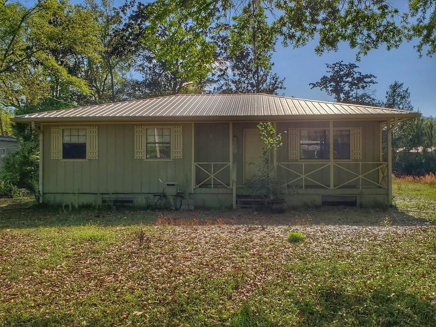 This cute cottage style home just needs a little TLC. This blank slate could be turned into whatever you have in mind. The sellers have completely renovated the master bathroom and both of the bedrooms with new paint, flooring and tile. Very conveniently located to the beaches with just a short 15 minute drive. This home will need to be purchased cash or FHA Rehab loan. Buyer to verify all measurements.