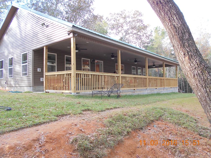 Less than a year old~ Custom Florida Cottage on 6.83 acres with private pond and just out of town~ Large front porch that over looks your private pond to enjoy your morning coffee or evening sunset~ This is the perfect retirement or starter home with very open floor plan~ The Bonus room can be turned into the 3rd bedroom~ Bath rooms and laundry room have tile flooring and the rest of the house has beautiful vinyl flooring~ The kitchen has a stainless steel gas stove and stunning custom counter tops~ The possibilities are endless just waiting for your personal touches~