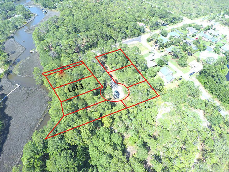 This beautiful waterfront lot is located in Mack Bayou Park, a new small subdivision conveniently located to Sacred Heart, Grand Boulevard (including Publix, Starbucks, movie theater, shopping, and restaurants) and only a 5-minute drive to the beach. This community will have underground utilities and could be a gated community with a community dock. Lots 2, 3, 4 & 5 are waterfront on Mack Bayou with deep water leading straight to the wide-open bay. Lot 1 serves as deeded access for lots 6, 7, and 8.