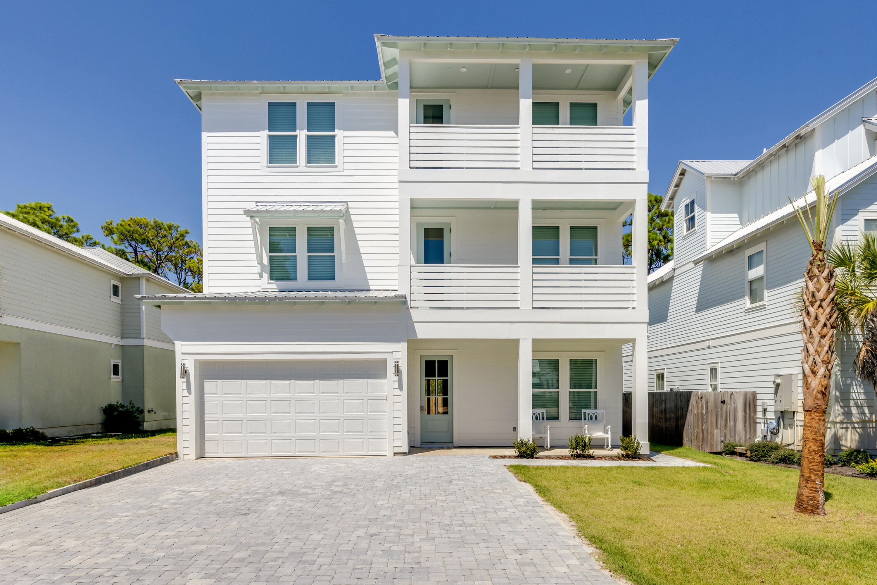 Located in the exclusive gated community of Frangista Beach in Miramar Beach, FL, this stunning three-story luxury home offers over 5,000 square feet, is 90% complete, and features 6 bedrooms, 5 full bathrooms, and 2 half bathrooms, and will be delivered fully furnished, rental ready, and with a golf cart included. Just a short walk from private beach access, home is designed for entertaining and relaxation, the open-concept living spaces feature wood-plank ceilings, recessed lighting, and sliding glass doors that flow seamlessly to a covered porch and backyard putting green. this residence combines modern design with elegant coastal finishes, including a spa-inspired primary bath with a freestanding soaking tub, backlit LED mirrors, dual vanities, and an oversized marble walk-in shower accented by striking stone-look tile. The chef's kitchen showcases a massive quartz island with seating for eight, custom cabinetry with gold hardware, a Forno bronze-and-white gas stove with matching hood, double ovens, stainless-steel refrigerator, wine refrigerator, and under-counter ice maker. A beverage station with wine rack and wine cooler adds a touch of convenience, while the wood-plank ceiling and modern gold pendant lighting create warmth and coastal charm. The home also offers two spacious balconies, a covered porch, a backyard putting green, and a game room with casino-style entertainment and a hidden bonus space, while guest rooms are generously sized to accommodate multiple queen beds and bunks. With a heated/cooled garage designed to include a virtual golf simulator, this home is perfectly suited for entertaining, relaxing, or generating strong rental income in one of the Emerald Coast's most desirable communities.