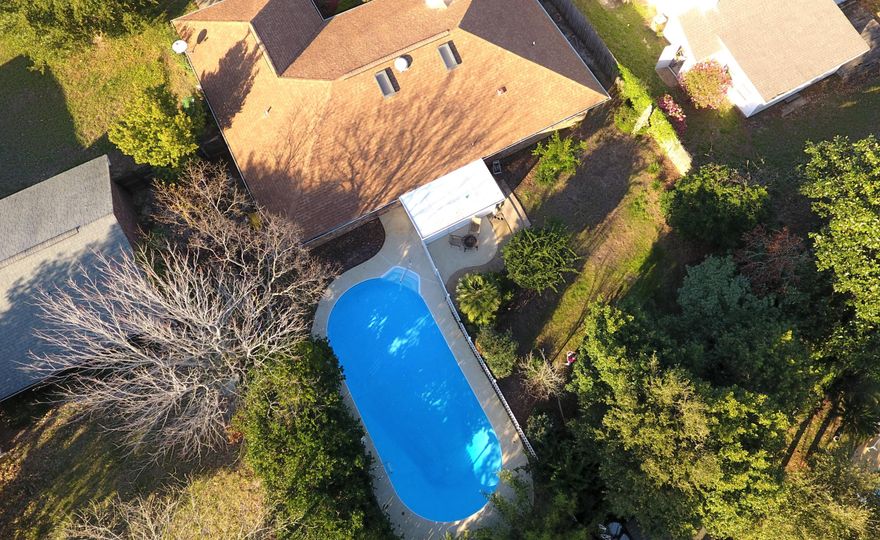 Summer is right around the corner and there are no other oases like this. The home courageously boast a 40-ft. pool that is enclosed by a white picket fence. The back yard is outlined with lush greenery and has both orange and banana trees which bear fruit. Another perk about this home is the enormous master suite which is 18x 14! The Mediterranean style master bath shows off a complete tile shower with a glass door. There is so much more, stop by today!