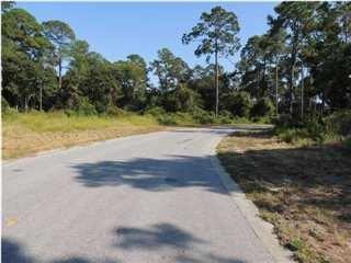 Premium ''B'' lot with truly unique position with shotgun views down the 11th Fairway. If a golf course lot is what you are looking for with unparalleled views, then you don't want to miss the opportunity to show this lot to your buyers. This lot is highly regarded among Wild Heron residents because of its high and dry location and expansive size (just under 1/2 acre). Wild Heron is nestled alongside beautiful Lake Powell and Greg Norman's Sharks Tooth Golf course, you'll find a unique Coastal Craftsman community. This homesite offers secluded privacy for your family just beyond hole #11. Wild Heron is an upscale gated community offering exclusive amenities such as a beautiful Clubhouse, Pro-Shop, private Gulf-Front Beach Club, racquet club (under construction), fitness center, pool,
