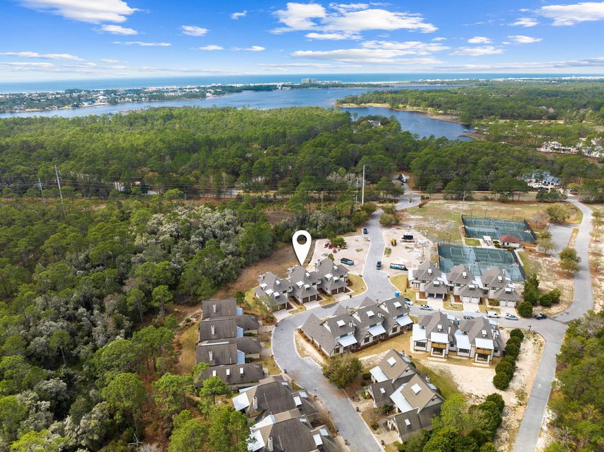 St. Joe Watersound Club membership and two years of dues paid are to convey with sale of the property. Discover the epitome of upscale living at the Townhomes at the Courts, a new construction opportunity nestled within the prestigious and private community of Wild Heron. The expertly planned three-bedroom floorplans redefine modern elegance with luxurious finishes and thoughtfully designed spaces totaling up to 2,600 square feet of living area and attached two-car garages.Step inside and experience the true essence of luxury living with top-tier finishes and design packages that exude sophistication and class. From designer fixtures to gleaming hardwood floors and premium cabinetry, every detail has been carefully considered to create an inviting and elegant ambiance.