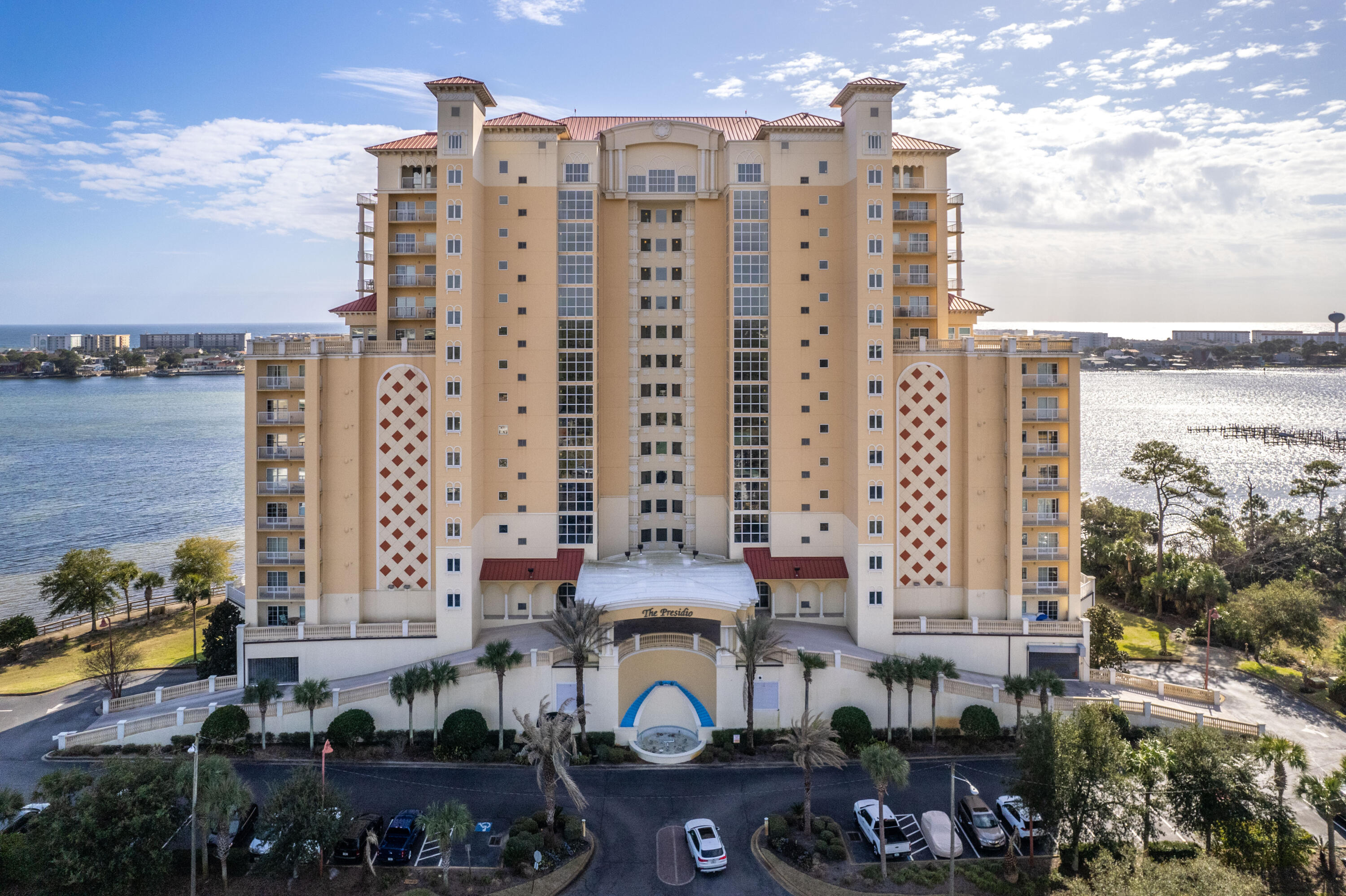 Unsurpassed views of the Gulf of Mexico and Intracoastal Waterway from this 3 bedroom END unit located on the 5th floor. This unit has 2 balconies: a private balcony with view of the city, and a wrap-around balcony accessed from both the living area and master bedroom. This balcony can serve as an extended living space to witness beautiful sunrises while avoiding the direct afternoon sun. Upgrades include bullnose corners, tile tub surrounds, granite counters in the kitchen and all baths, Thomasville cherry wood cabinets, tile plank flooring in the living room, oversized tile throughout, master bathroom with walk-in tiled shower, separate garden tub, and double sinks. Storage is abundant: the oversized master bedroom walk-in master closet, pantry, a double linen closet in entry, and walk-in closets in entry hallway and guest bedroom. The 2nd master bedroom (with private bathroom) has it's own separate balcony to take in city views. Enjoy the benefits of an enclosed parking garage, with 2 deeded parking spaces located close to the elevator. This well planned development features 2 elevators on each end of the building, with floor to ceiling glass elevator landings to enjoy views from each floor. A carpeted hallway leads to the unit, and a private 16x6 storage room is located directly outside the unit's entry door. All occupants have a community gym, waterfront pool and hot tub with views of the boat dock. The association room with large deck and waterfront views is available for use, along with a lounge/ media room with comfortable seating. A guest apartment can also be reserved. Seller is motivated, and has priced for a fast sale. Buyer to verify all measurements and pertinent information. No short term rentals allowed, property qualifies for VA financing. This unit does not come with a boat slip.