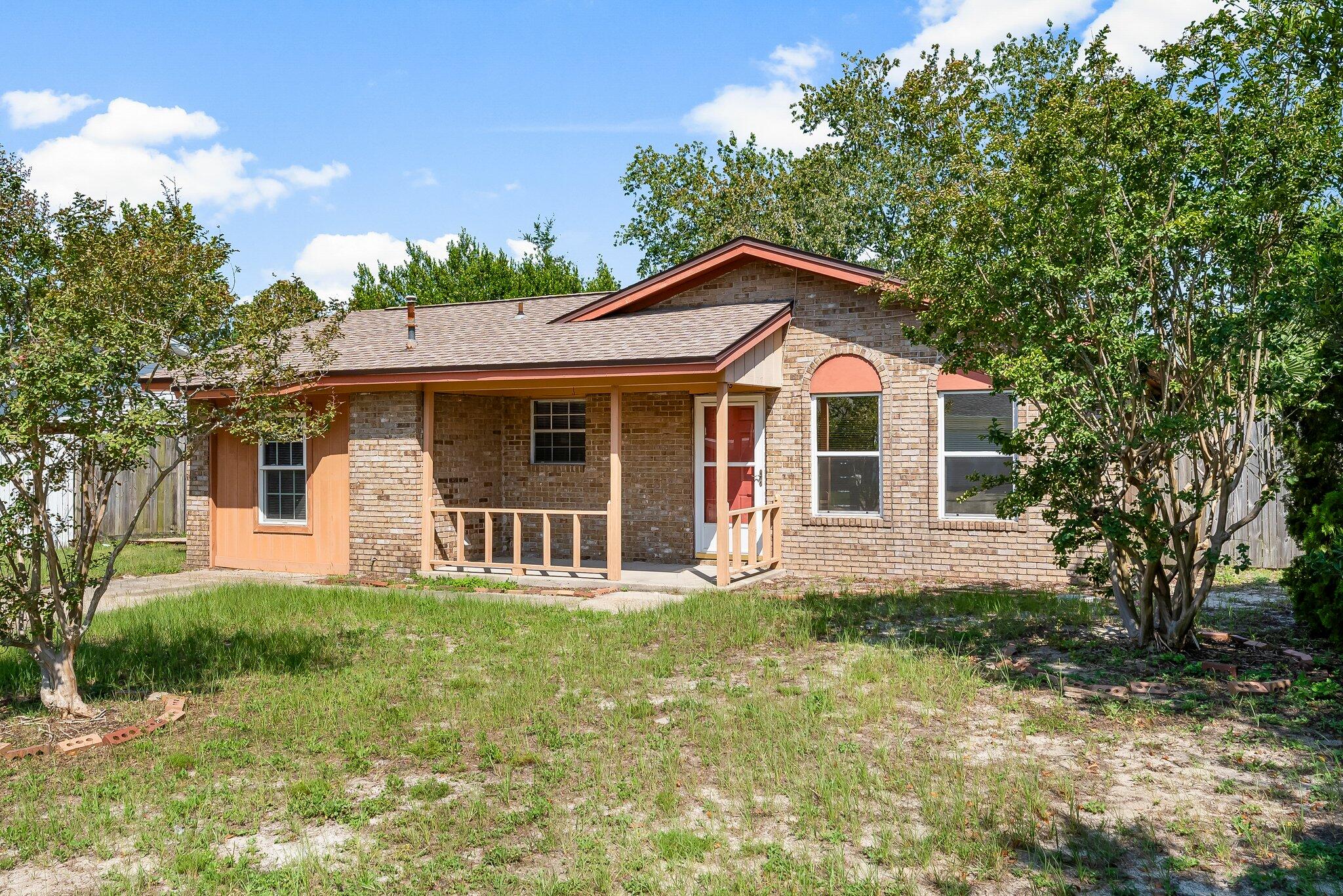 A charming, move-in ready home that's perfect as a starter or a blank canvas for your own personal updates. Centrally located in Panama City, you'll be just 4 minutes to Gulf Coast State College and FSU's campus, and close to shopping, dining, and entertainment. This 3-bedroom, 2-bathroom home features a spacious kitchen, a formal dining room with built-in china cabinets, and a cozy bonus room off the kitchen that would make a wonderful home office, playroom, or flex space. The laundry hookups are also conveniently located in this area. The fully fenced backyard offers privacy and includes a small shed for extra storage or lawn equipment. Enjoy the inviting covered front patio perfect for potted plants and creating instant curb appeal. Florida room through French doors perfect for enjoying the Florida weather. With a new roof installed in February 2019 and water heater 2018 all the essentials in place, this home is truly move-in ready while leaving plenty of room for you to add your own personal touch.