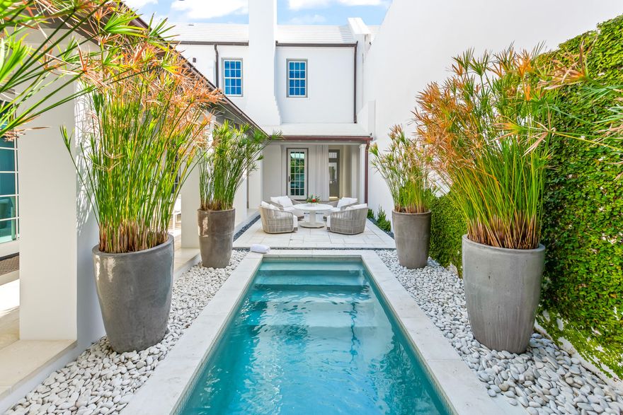 This classic Alys Beach courtyard home design by Gary Justiss Architect is located on iconic N. Charles Street. This three bedroom, three and one half bath home offers a first floor primary suite, a generous courtyard with pool and summer kitchen, open loggias, and a rooftop terrace. Professional interior designs by Betsy Brown give the interiors a tasteful and contemporary feel. Interior details such as Venetian plaster walls and ceilings, Carrara marble throughout the kitchen and bathrooms and upgrades Wolf and Sub-Zero appliance elevate this beautiful home.