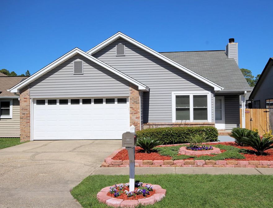 This well kept house is within minutes of Hurlburt Field AFB and white sand beaches! Nice sized three bedrooms, two baths and two car garage. Spacious living room with cozy fireplace. Airy kitchen and dinning combo. Stainless Refrigerator. Large deck that is accessible from the master bedroom and living room area. Lush landscaping with lots of flowers and fruit trees. It's a great curb appeal! New fenced yard for your privacy. One year home warranty provided. New A/C unit this year.