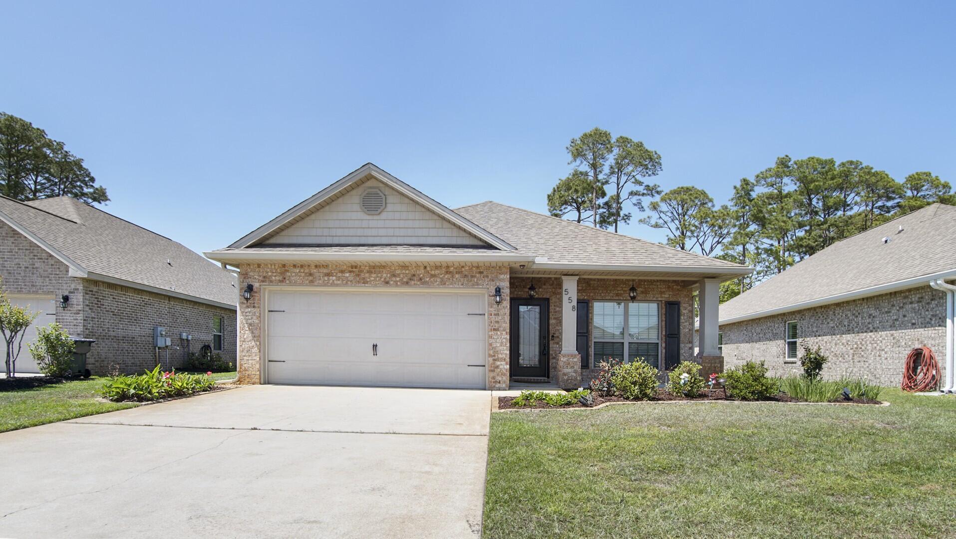 Welcome to your coastal Craftsman-style home, w/ PAID IN FULL SOLAR, in the sought-after Driftwood Estates! This 3BR, 2BA gem offers an open floor plan, granite counters, SS appliances, tray ceilings, crown molding, a custom wine bar, hurricane shutters, and an epoxy-finished garage with built-in storage. Enjoy two screened-in porches and an entertainer's dream backyard with an outdoor kitchen--featuring two grills, a smoker, bun warmer, and solar lights. Lush landscaping includes a fruitful grapefruit tree, The fully paid-off solar panels, keeping utilities averaging $25/mo. Community includes: a pool, large park w/ trails, pickle ball & tennis courts & more!