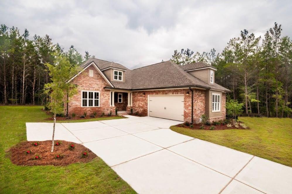 The Hawthorn plan has 2,348 square feet, 3 bedroom, flex room with wood glass french doors and 2 1/2 baths. Brick exterior, low E-vinyl windows, covered rear porch and a 2 car garage. Interior finishings include, 9' ceilings, granite counter tops, laminate, tile and carpeted floor coverings, crown molding, cased windows and openings. Natural gas range and Rannai tank water heater. Stainless Frigidaire appliances, WoodHarbor cabinets. Additional upgrades include base and upper cabinets with sink in laundry room, drop zone cabinet, laminate in flex, extended island w/ legs, floor plug in living room and ceiling fan on back porch. Fence included!! Hammock Bay is a 3,200 acre master planned development which offers a clubhouse, movie theater, pools, workout facility and nature trails.