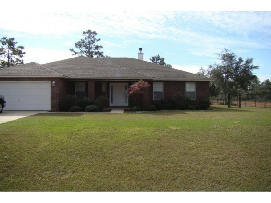 Immaculate, all brick house in Holley-By-The-Sea with split floor plan, approximately 2,600 sq foot, built in 2005. Four bedrooms, two baths, two car garage with electric door opener, formal living and dining room, breakfast nook, covered porch, covered patio and fenced back yard. Huge kitchen with raised counters (breakfast bar), and stainless steel appliances (dishwasher, built in microwave, electric stove, double door refrigerator), plenty of pantries including a walking pantry. The family room (wired for surround sound) has vaulted ceiling and fireplace. The master bedroom features a large walk-in closet, dual vanity, separate shower and garden tub. The second full bathroom has a back door leading to the patio and backyard.