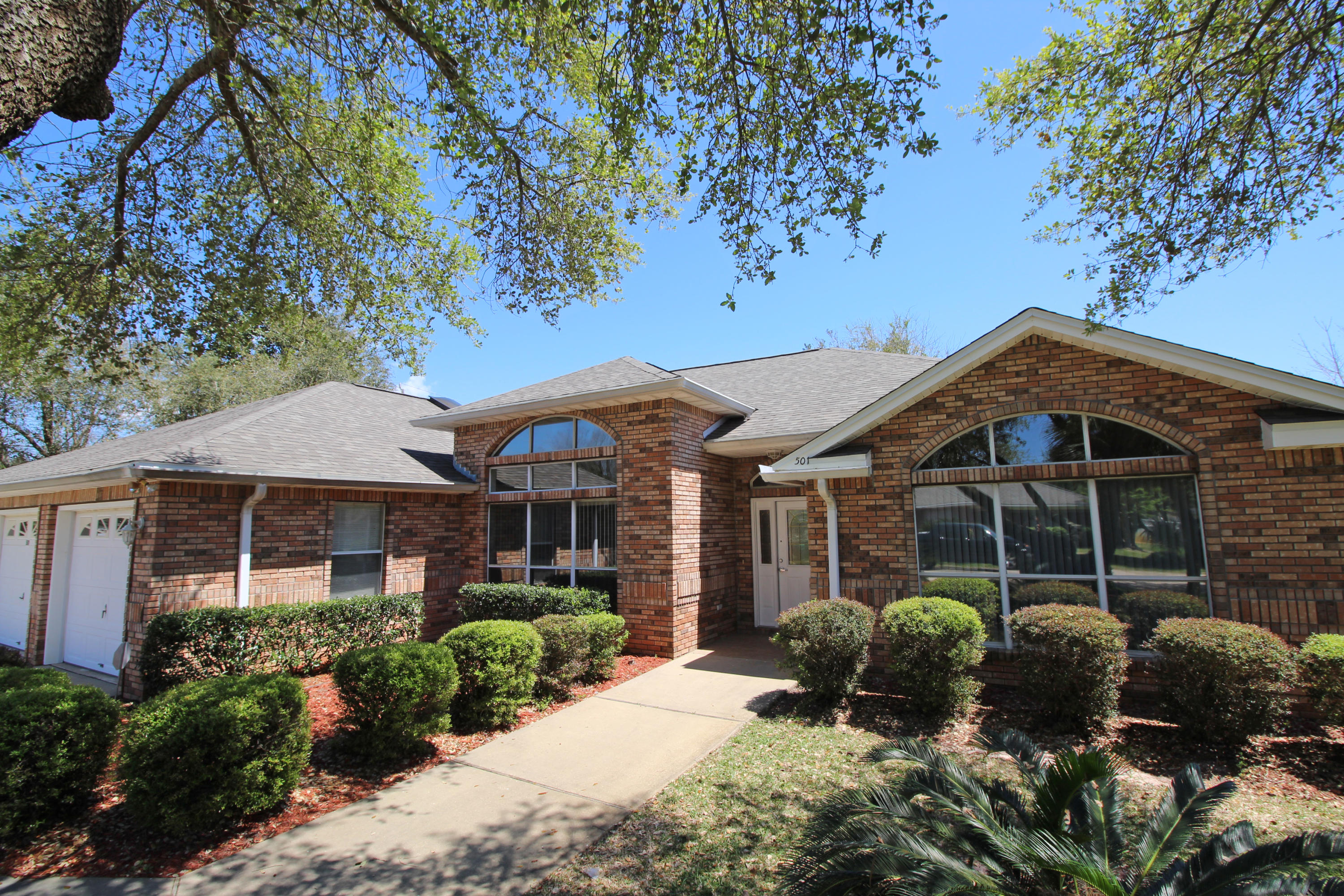 BEAUTIFUL ALL BRICK EXECUTIVE HOME IN A STUNNING WATERFRONT COMMUNITY!! Step inside to find high volume ceilings, crown molding, bullnose corners and tile flooring. Spacious living area with recessed lighting, custom cabinets on each side of the gas fireplace with mirrored accent above the mantle. Elegant formal dining room with treyed ceiling perfect for entertaining. Light and bright kitchen with lots of custom cabinets to include pull outs and a wine rack, counter space galore, designer triple sink, new smudge free stainless appliances with 5 burner gas stove/convection, two pantries and large center island with sink and disposal. Breakfast nook has lots of windows and opens into the living area. Master bedroom has treyed ceiling, two walk-in closets and sliding glass doors