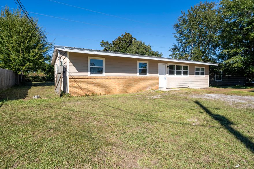 Welcome to 2608 W 21st Street, a fully remodeled gem in the heart of Panama City. This charming 3-bedroom single-family home sits on a spacious 0.24-acre lot offering over 10,000 square feet of outdoor potential with no rear neighbors, providing excellent privacy and the perfect space to build a pool or create your dream backyard retreat. Inside, the home boasts some nice renovations including a newer metal roof, new windows, new flooring, updated kitchen with sleek cabinetry and brand new appliances, and a beautifully tiled bathroom with modern finishes. The living room is bright and welcoming, creating an inviting atmosphere for relaxing or entertaining. Conveniently located near US Highway 98 and Beck Avenue, this home is just minutes from schools, grocery stores, and local amenities. With its contemporary upgrades, oversized lot, and prime location, this home offers the ideal blend of comfort, style, and value. Don't miss your opportunity to own this move-in-ready property. Schedule your showing today.