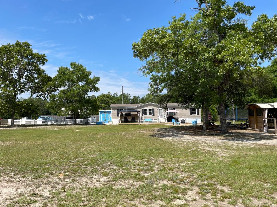**Charming 2021 Manufactured Home on 1.03 Acres - Move-In Ready with Upgrades!**With a recent appraisal at $265,000 this is a steal of a deal!  Seller is ready to move, so bring us an offer. Welcome to your slice of paradise in Crestview, FL! This well-maintained 2021 manufactured home sits on a fully fenced and mostly cleared 1.03-acre lot, offering privacy, space, and convenience. With thoughtful upgrades and outdoor enhancements, this property is perfect for those who love both comfort and the outdoors, and is a blank canvas for those with a green thumb wanting to grow your own produce. Sellers have made a start by planting an Olive tree and Blueberry bush- and you can now add your favorites to the landscape! The home features an open and functional layout with modern finishes throughout. Enjoy morning coffee or evening relaxation on the spacious front deck with patio furniture (including a charming gazebo) that will convey with sale. The property includes a 30-amp RV plug and large metal carportideal for visiting guests or your own travel setup.

Outdoor living is a breeze with built-in planter beds ready for your garden,  and a Coleman spa on the rear deck for year-round relaxation. A standout feature is the insulated workshop with added deck and canopyperfect for hobbies, storage, or a quiet workspace.  A smaller storage unit by the carport that is being used as an office and a larger green shed in the back can be sold as well- contact your agent for details.

Located just minutes from shopping, schools, and local amenities, yet with a peaceful country feel, this property blends rural living with modern convenience. Whether you're looking for a primary residence, weekend getaway, or rental opportunity, this turn-key home is a must-see.
