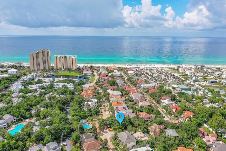 Fabulous corner lot with large buffer nestled in the French caribbean style gulf front neighborhood of Caribe.   Charming paved streets and limestone fountains adorn this gated community.  Caribe amenities include two pools, a tennis court and private deeded beach access.  House plans for this lot have already received final approval by the HOA.  Caribe is located south of highway 98 near Grand Boulevard and convenient to fabulous upscale shopping and world famous restaurants.  Caribe does allow short term rentals but with some restrictions.  Please see rental requirement documents in listing.