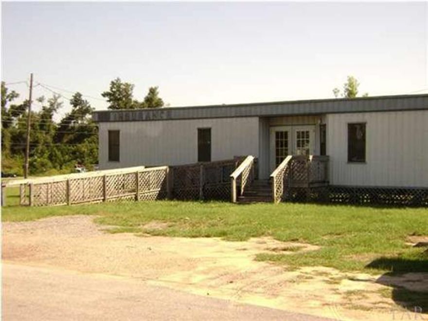 30,000 Traffic Count on this part of Hwy 90. Small office building with 2 offices, a customer room, a 1/2 bath and a kitchenette area. Great location for a business wanting to get the most exposure for the smallest rent. Plenty of space by Hwy 90 for service equipment or outside retail inventory. Pictures were taken before the last tenant.