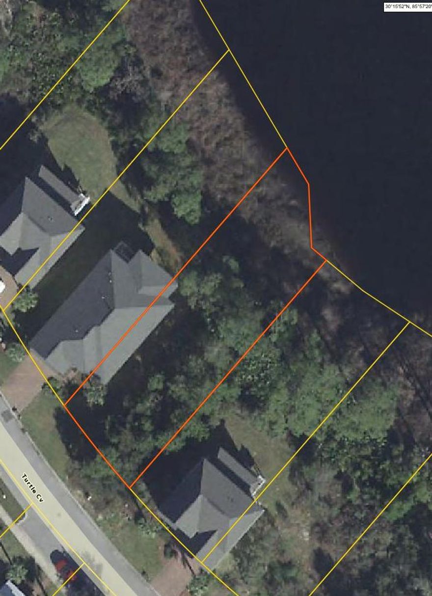 WOODED LAKE FRONT lot in Turtle Cove at Lake Powell. NO BUILD OUT TIME. Amenities of the community include a club house with fitness center, community pool and newly resurfaced tennis courts. There is also a community dock on Lake Powell. Turtle Cove at Lake Powell is adjacent to the Wild Heron development and Sharks Tooth golf course. Minutes away from the new 30 Avenue center with restaurants and shopping, Rosemary Beach and Pier Park. Survey in Documents