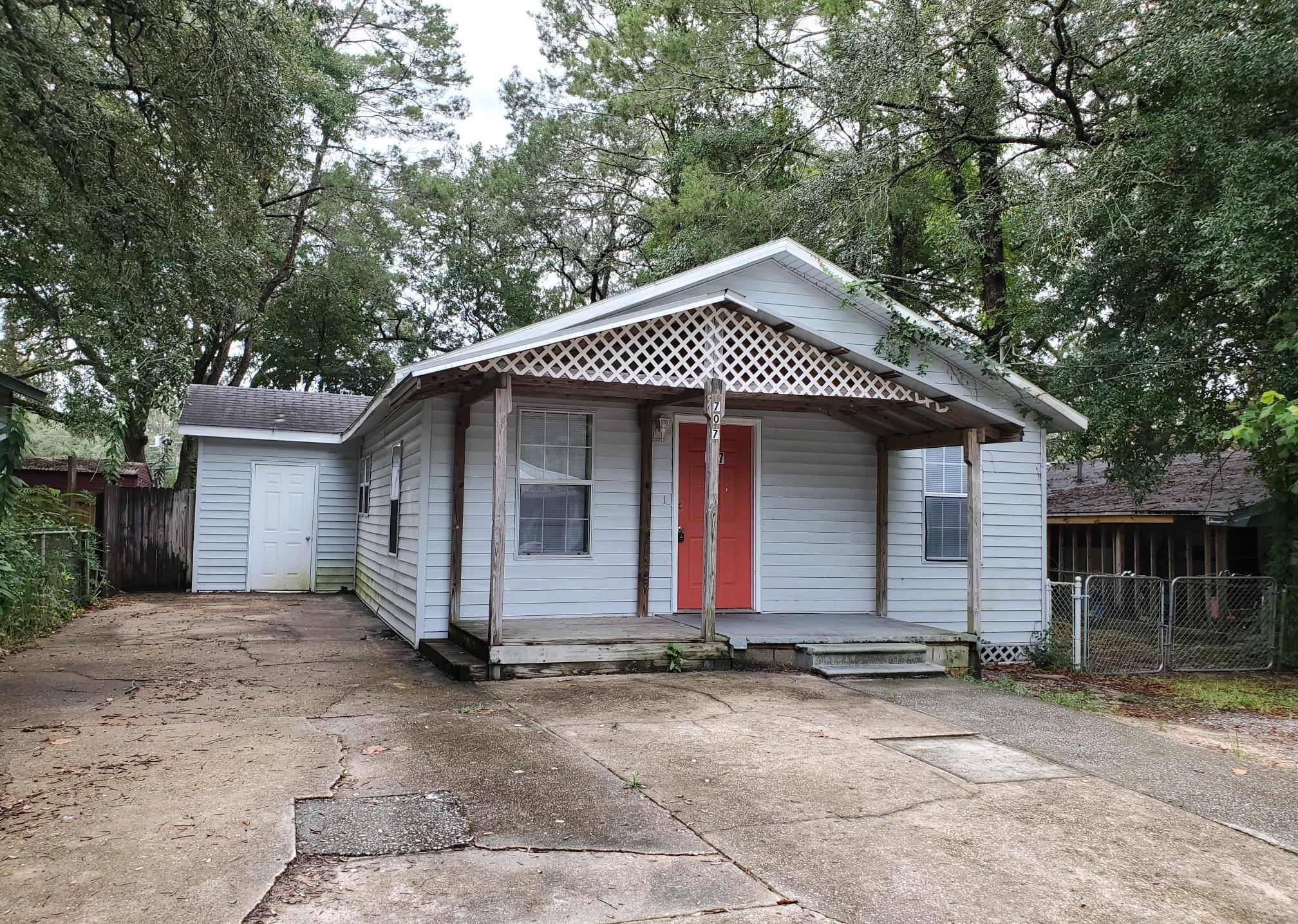 Cute 3 bedroom 2 bath cottage style home for sale in Niceville. This property features ample front parking, an open porch, and open living/dining/kitchen area. Large second living room at back of house. Laminate floors, carpet in bedrooms, and large open deck off of back perfect for entertaining. Additional storage area on side of house. This would make the perfect starter home or income property! Vacant and easy to show.