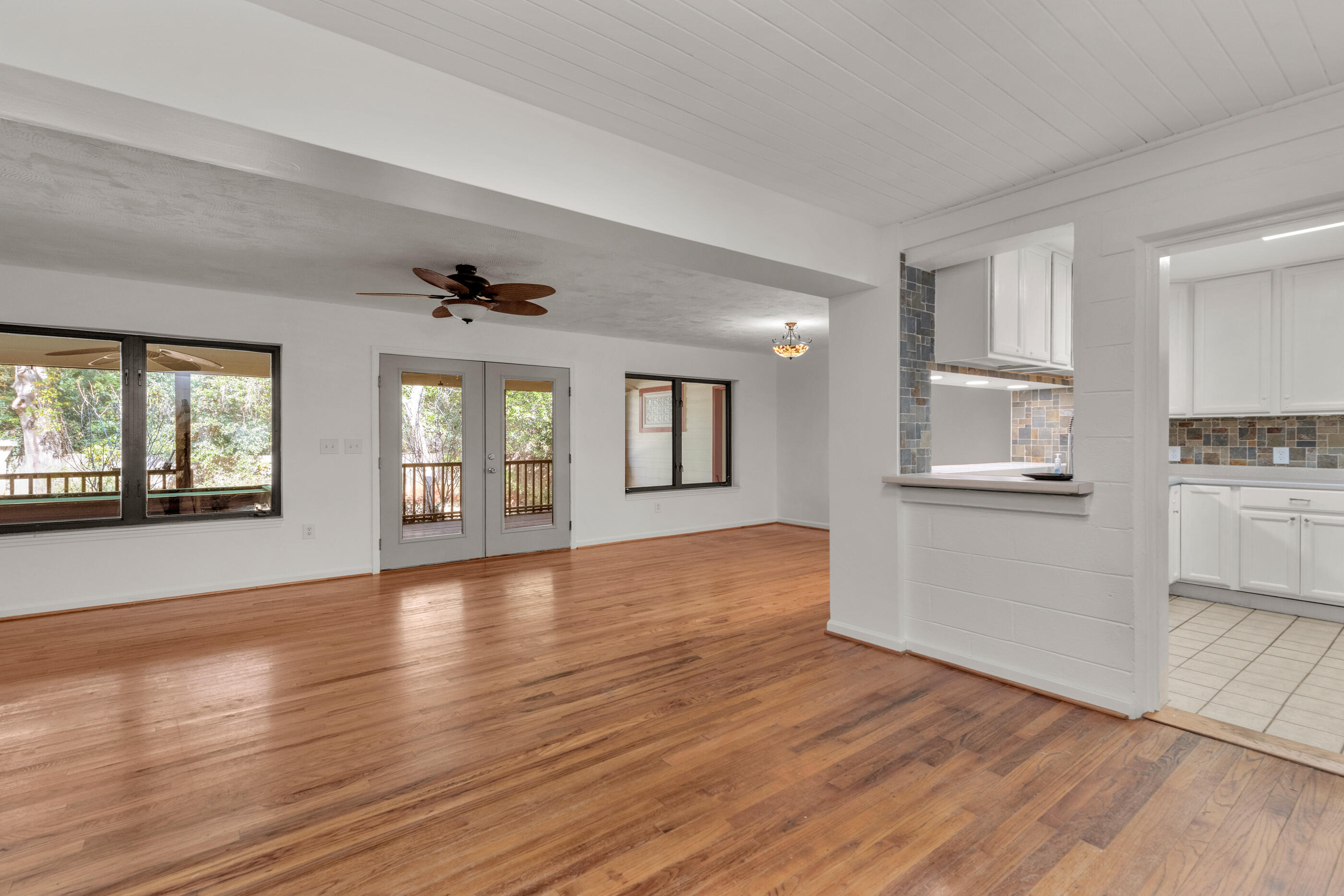 Welcome home to your renovated, age defying, Old Florida Home established in an absolutely beautiful NW Florida green space! Located in the sought-after Garniers Beach neighborhood, this home is perfectly positioned with quick access to everything Fort Walton Beach has to offer. This home was lovingly maintained and is move in ready. This refurbished home has great curb appeal, offers a peaceful, tranquil garden full of beautiful established camellias, azaleas, oaks and a magnificent magnolia. As you head towards the front door, you'll notice a large 10x 22 storage/workshop garage and a 1 -1/2 parking garage that is insulated that features a full bathroom. Step inside your home and you'll fall in love with all the natural light and hardwood floors throughout. Head straight forward and a very large family room opens to a renovated kitchen and access to your incredible 12x27 screened in covered porch. Head back towards the right side of the house, you'll walk past your 2 guest bedrooms and a guest bath. Continuing further back, you'll find a wonderful 16x16 master bedroom suite featuring an additional 9x11 sitting/office area, generous walk-in closet and a handicap accessible master bath with walk-in tiled shower, and dual sinks and lots of cabinets. In addition to this 1820 sq foot home, this house has amazing storage including a 1,500 sq foot floored attic with access through a commercial grade pulldown staircase. Although this home was built in 1950 it went through massive upgrades in 2003-2004. This home is across the street from the bayou and is conveniently located to all area bases, shopping, restaurants and entertainment, schools, and is only 2 blocks to Garniers Beach Park with 240 feet of beach of Choctawhatchee Bay, public boat ramp, restrooms, playground equipment and picnic. Call to schedule a showing today!