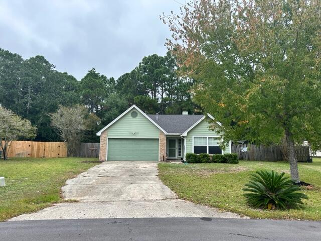 This freshly updated cottage is located in a neighborhood that is just off of HWY 98 in East Navarre, making it near the beach, shopping and schools. Step into the tiled foyer and notice the brand new LVP flooring that runs through out the house. The home has just been repainted in a cool costal color that will blend with any decor. The Living Room offers tall ceilings, with fireplace, ceiling fan and sliding doors to the screen in porch. Kitchen has beautiful custom painted cabinets, with almost new stainless Fridge w/ ice maker, Glass Top Stove, Dishwasher and Microwave. As well as the spacious Kitchen/Dining Area. Hall bath has been updated with large tile walk in shower, toilet, marble counter and lighting. All bedrooms have new flooring and paint. Each offer fans and plenty of