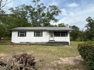 Discover this charming home located just minutes from the historic heart of downtown Defuniak Springs. This property offers a wonderful opportunity for those looking to move to the beautiful town. The home's classic design provides a solid foundation for your personal updates and improvements. Enjoy outdoor living on large backyard perfect for relaxing or entertaining. The property is conveniently situated close to local shops, restaurants, parks, and the iconic Circle Drive, giving you easy access to all the amenities and attractions this charming town has to offer. Whether you're an investor, DIY enthusiast, or looking to create your dream home, this property offers great potential in a desirable location. Don't miss out - schedule your showing today and explore the possibilities.