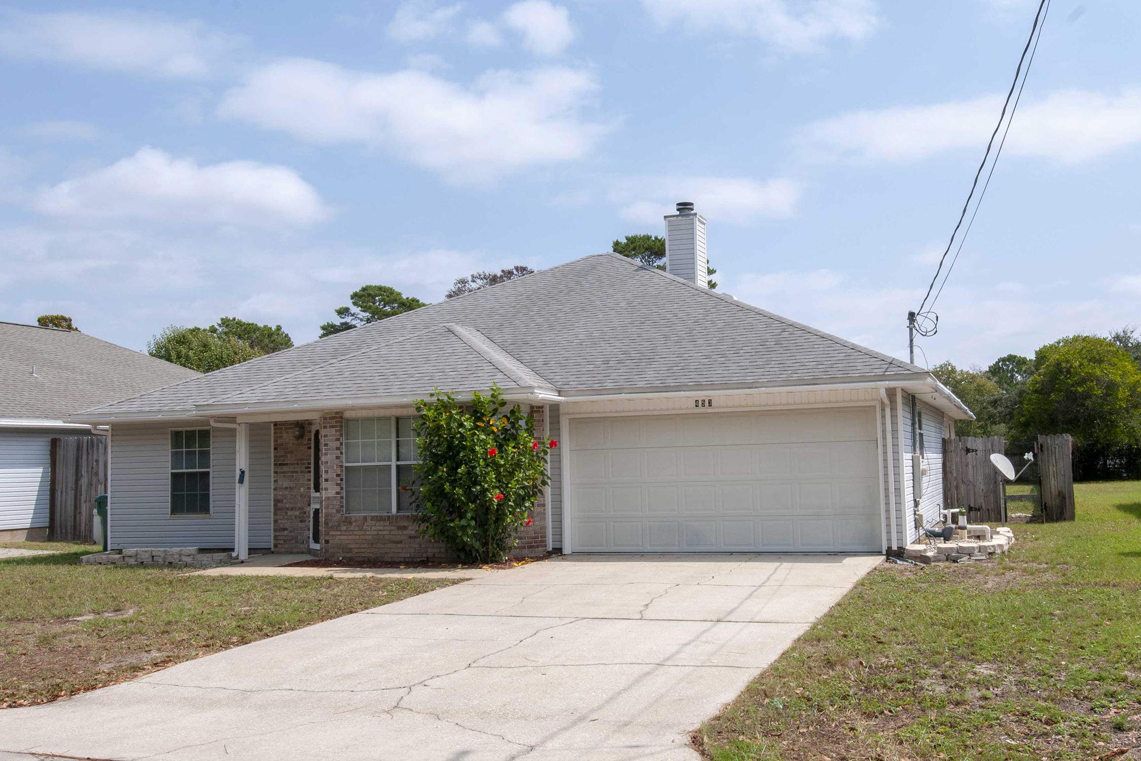 Enjoy grilling out with friends on the large covered back patio. The spacious kitchen is perfect for entertaining guests. There's plenty of room for everyone in this 3 bedroom, 2 bath home with over a quarter acre fenced yard. Think of decorating the picturesque fireplace mantle during the holidays.Park your car and your water toys in the large two car attached garage. This location is absolutely ideal! Just 6 miles from the beautiful sugar sands of Navarre beach and only 6 miles to Hurlburt Field. No showings until the weekend of September 13th please.