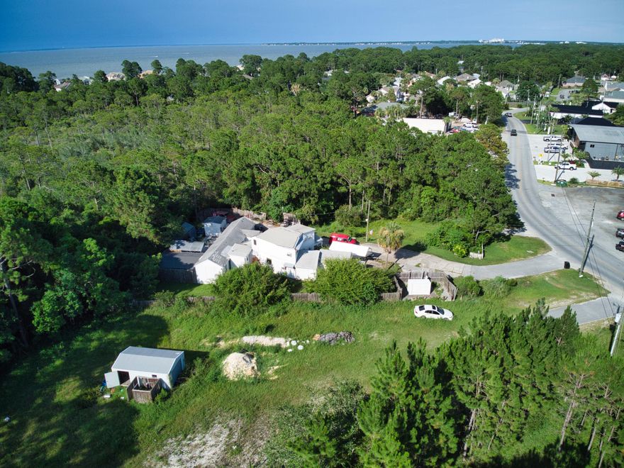 Property currently has a mobile home and storage building on it, but is being sold for land value. Zoning is Coastal Center. Located in Miramar Beach on Holiday Road just North of Hwy 98. Sprint Florida Incorporated has an easement on the front of the property. Buyer to verify all information. Sold AS-IS Also listed MLS 905061 and MLS 905150