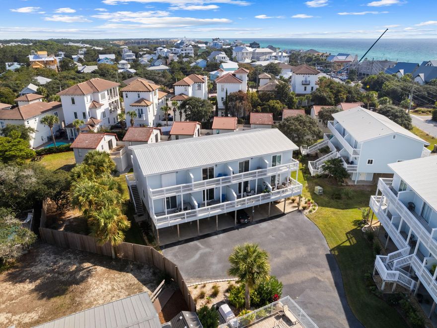 Boasting a great location south of 30A, this adorable beach townhome has been completely updated and presents as new. New flooring, new kitchen appliances and sparkling updated bathrooms make this an outstanding townhouse property at this price point. Access to Blue Mountain Beach is a short stroll away from this spacious retreat. Look forward to morning walks with pelicans and sandpipers, or days spent swimming, sunbathing and shelling in this unspoiled location. Covered parking beneath the home provides shady space for two vehicles plus a golf cart, which is included in the sale. The first floor also has a huge storage space for bicycles, beach chairs, kayaks and other essentials. Head up the steps and in through the door to appreciate the light and spacious living room with an attractive dining area. Relax on the sleeper sofa and watch your favorite movies on the flatscreen TV. The kitchen space showcases white cabinets and all-new stainless appliances. Chic gulf-blue tiles on the backsplash, new flooring and neat shiplap detail add to the coastal vibe. A separate stacked washer and dryer take care of daily pool and beach towels. Three large balconies provide endless outdoor space for dining, entertaining and enjoying gentle gulf breezes and stunning sunsets. The wooden deck has peaceful views across the pool and wider community. Two shiny new bathrooms and two bedrooms on the top floor can easily sleep six or more guests. There are bunk beds and a queen-size bed in the second bedroom and the king-size master has a connected balcony for your own private space. Sandcastles by the Sea has a beautiful community swimming pool and is super convenient for local shopping and dining. All this and more, just few steps from one of the most beautiful white sandy beaches in the area.