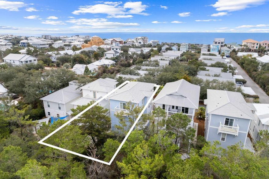 Backing up to Camp Creek Golf Course and just steps from deeded beach access and the community pool, this beach cottage is the perfect coastal getaway or rental investment property. Steps lead to both a front entry and side entry with porches on all levels along with a private back patio delivering enviable outdoor living space for relaxing and dining in the sun. The main entry opens to a spacious living area filled with natural light, new flooring and updated furniture. The living area seamlessly flows into the dining space and newly renovated kitchen boasting a center island, ample storage and stainless steel appliances. A renovated full bathroom, laundry room and large storage closet add additional conveniences to the first level. The second level features two oversized guest bedrooms each with ensuite bathrooms along with hallway bunkbeds for flexible sleeping space. The third level offers two additional bedrooms, a guest room with an ensuite bathroom and the primary bedroom. The spacious primary suite features a sitting area, ensuite with dual vanities and a balcony with views of the gulf and neighboring rooftops. Cottages at Camp Creek is a charming neighborhood offering easy access to Scenic Highway 30A in close proximity to Alys Beach and Rosemary Beach with renowned restaurants, local shopping, seasonal events and weekly farmers markets. This community is centered around the large pool and hot tub surrounded with lush landscaping with the deeded beach access just a short walk down 30A.