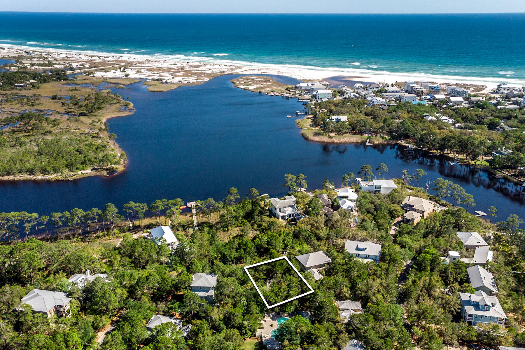 Welcome to Lakeplace in Grayton Beach. This private, gated, short-term rental restricted community is just northeast of historic Grayton Beach and within walking distance of fabulous restaurants and amenities. This incredible homesite is just one row off of Western Lake and directly across from the community dock. Lake views are achievable at 20' with gulf views at 30'. The neighborhood consists of 50 parcels nestled amongst well developed trees and foliage.Sellers have preliminary plans with approved neighborhood architect, Dan Martin, for a 3-story 3,150 square foot home that would capture views of both the gulf and Western Lake.