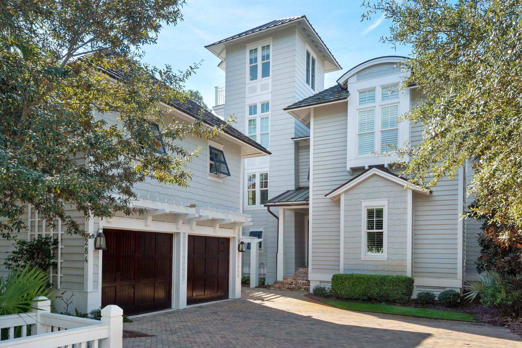 This refined WaterSound home boasts a prime location on a private lot tucked steps away from the Watersound Beach Club. Showcasing impeccable taste, every space has been updated with luxury furnishings, custom lighting, home automation and elegant finishes such as pecky cypress. The double height raftered family room adds to the sense of light and openness. The first floor provides a separate media room with bar and a fabulous master suite. The second floor contains three spacious bedrooms including a second master suite with beautiful views of the gulf. The 3rd floor tower provides stunning gulf views and is a perfect spot for sunset. Outdoor spaces abound with a screen porch and beautiful back yard. The carriage house provides a well-appointed private luxury retreat for house guests.