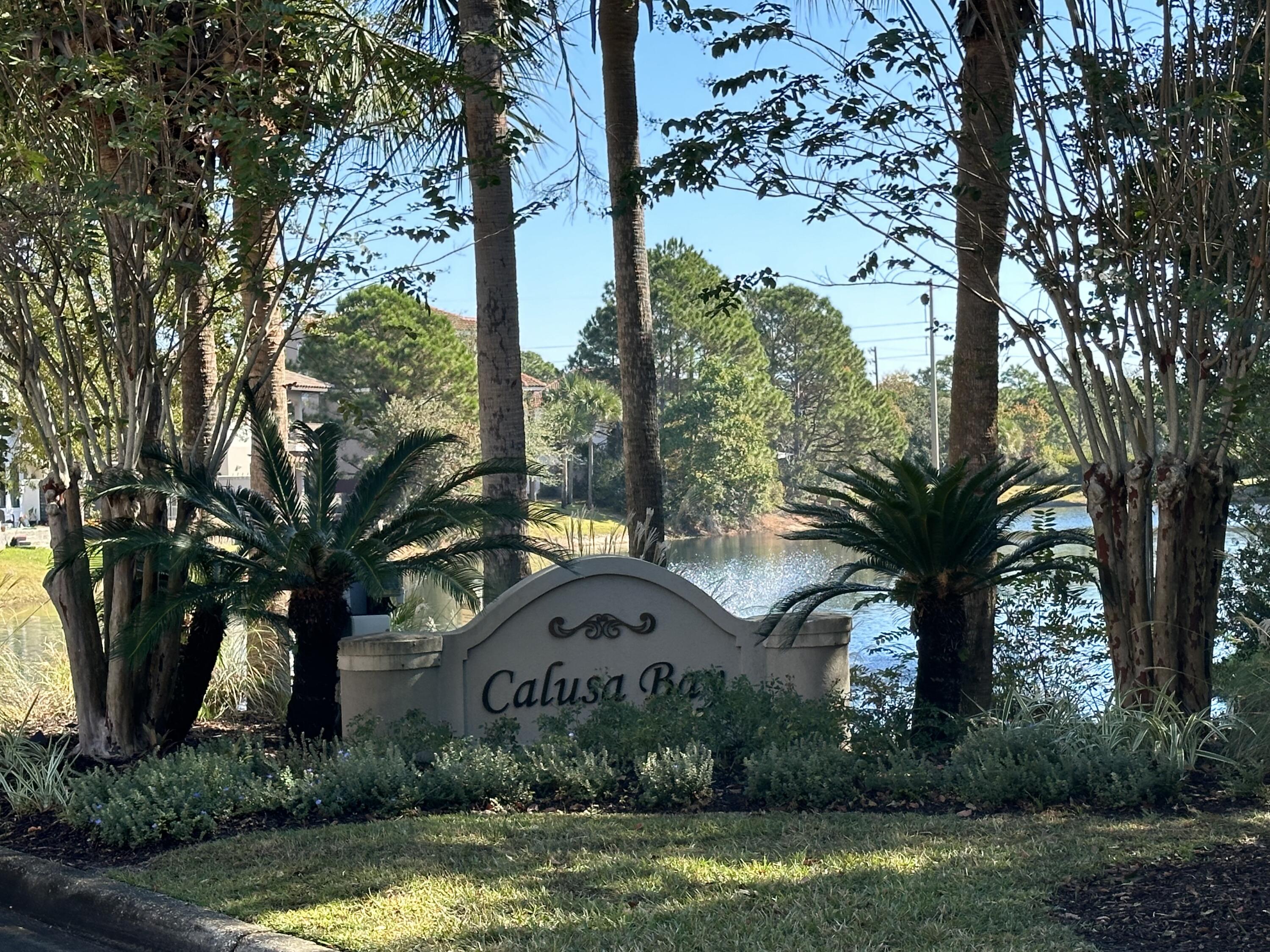 WOW! Seller offering 10k towards buyer closing!! Championship golf course views - no houses in your back yard. This mediterranean-style gem located in the prestigious gated community of Calusa Bay with 3-bedrooms and 2.5-bathroom. Home has been beautifully refreshed including, premium interior paint, new vinyl plank flooring downstairs, new plush carpet in the upstairs bedrooms and quartz countertops in the kitchen. Enjoy breathtaking sunsets glowing against the backdrop of Regatta Bay's championship golf course. The downstairs open floor plan seamlessly connects the living room, dining area, and a well-appointed kitchen, all appliances included. The upstairs master suite is a true retreat, featuring a lavish master bathroom with a huge shower, whirlpool tub, course. Down the hall you'll find two bedrooms and bathroom. A quaint, private neighborhood offering a nice community pool, and pedestrian path making it easy for residents to frequent the abundance of shops and restaurants close by - all of this just minutes to the beach. Don't miss this opportunity - call for your viewing today and start living your Mediterranean dream.